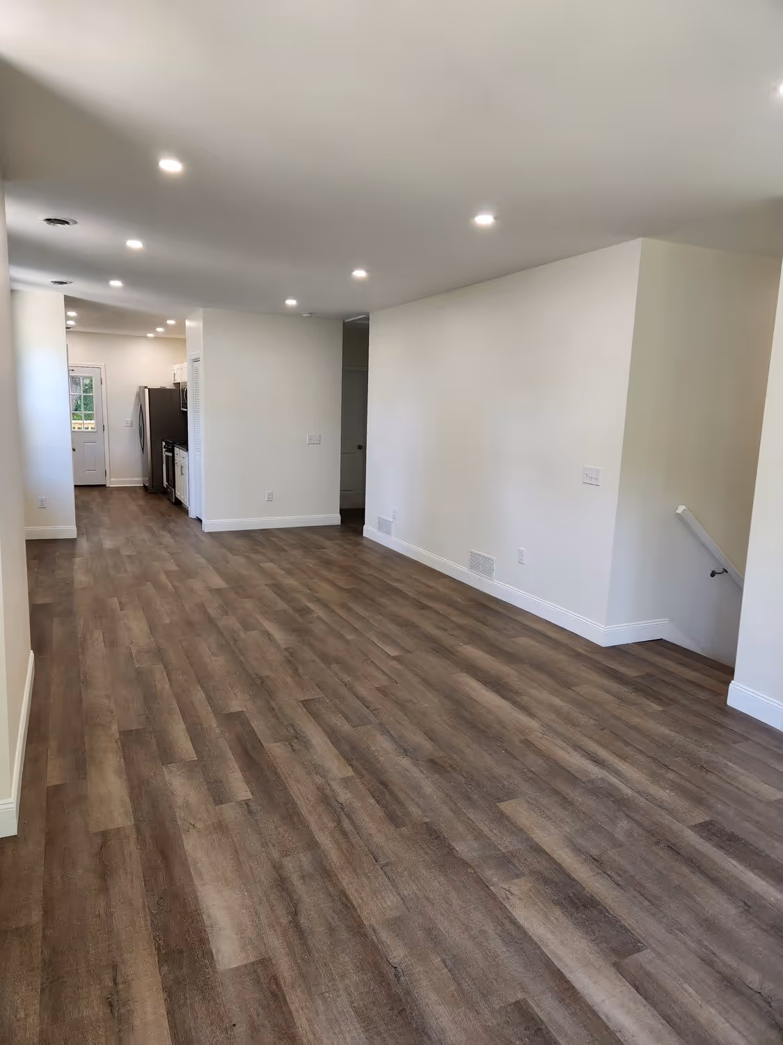 The finished open living area at 438 N. Fairmount, new plank flooring and recessed lighting